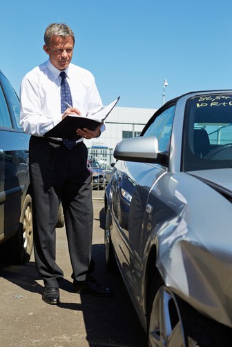 Collision Auto Body Estimator Preparing Estimate for Vehicle Repair of Auto Body Damage