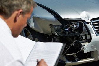 Collision Auto Body Estimator Inspecting Vehicle Interior Damage